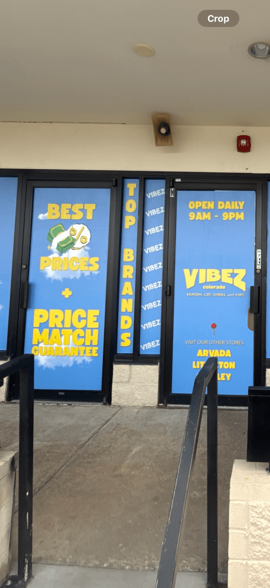 Retail entry door with branded vinyl graphics